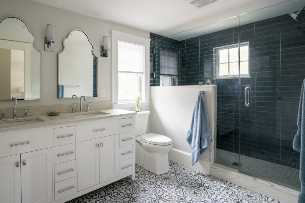 Inspiration for a transitional bathroom in Boston with shaker cabinets, white cabinets, an undermount sink, multi-coloured floor, a hinged shower door, a double vanity and a freestanding vanity.