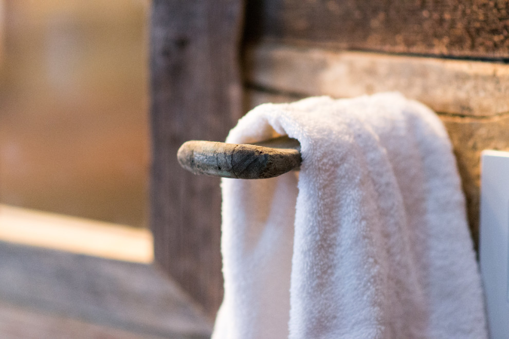 Mountain style bathroom photo in Toronto with wood countertops