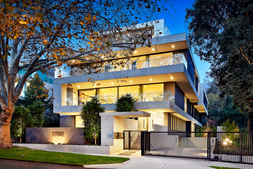 Expansive contemporary three-storey exterior in Melbourne with mixed siding and a flat roof.