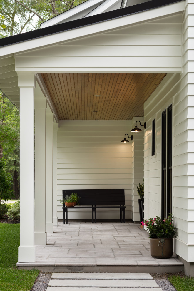 Woodland - Fron porch of modern luxury farmhouse in Pass Christian Mississippi photographed for Watters Architecture by Birmingham Alabama based architectural and interiors photographer Tommy Daspit.