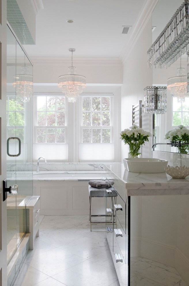 Large transitional master marble tile marble floor bathroom photo in Boston with a vessel sink, glass-front cabinets, white walls and marble countertops
