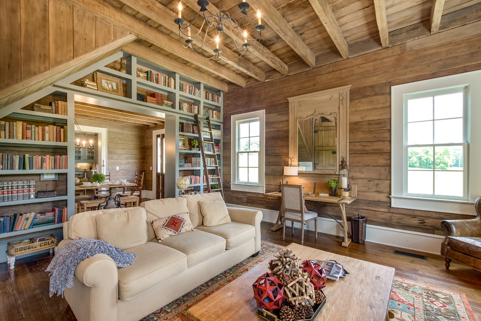 Design ideas for a country enclosed family room in Nashville with a library, brown walls and medium hardwood floors.