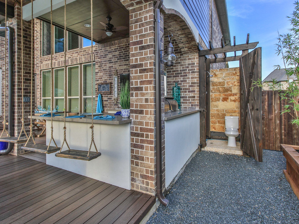 Photo of a mid-sized beach style backyard patio in Houston with an outdoor kitchen, decking and a gazebo/cabana.