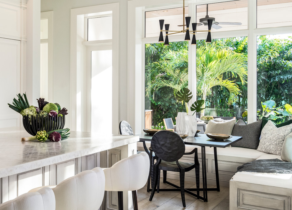 Open concept kitchen - light wood floor open concept kitchen idea with stainless steel appliances and an island