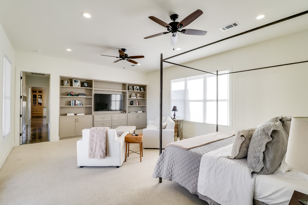 Large country master bedroom in Jackson with white walls, carpet, no fireplace and beige floor.