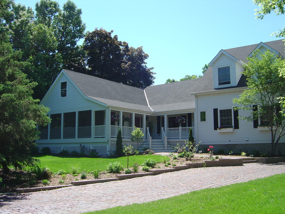 This is an example of a small traditional one-storey white exterior in Minneapolis with wood siding and a gable roof.