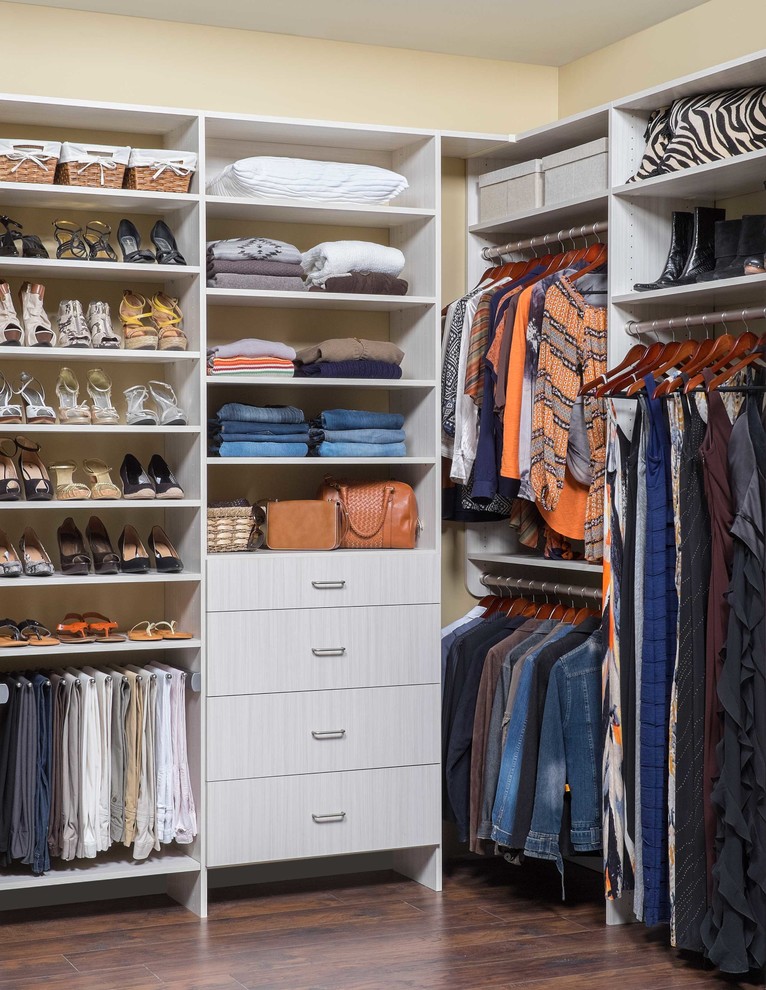 Walk-in closet - mid-sized transitional women's dark wood floor walk-in closet idea in Denver with flat-panel cabinets and white cabinets