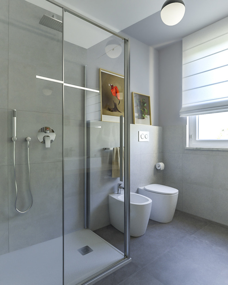 Mid-sized contemporary 3/4 bathroom in Milan with flat-panel cabinets, grey cabinets, a corner shower, a two-piece toilet, gray tile, porcelain tile, grey walls, porcelain floors, a vessel sink, wood benchtops, grey floor, a hinged shower door, a single vanity and a floating vanity.