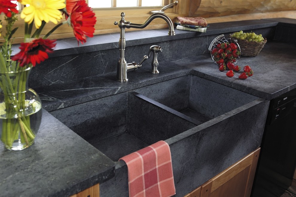 Home design - transitional single-wall ceramic tile and beige floor home design idea with a farmhouse sink, shaker cabinets, medium tone wood cabinets, soapstone countertops, beige backsplash, wood backsplash, stainless steel appliances and no island