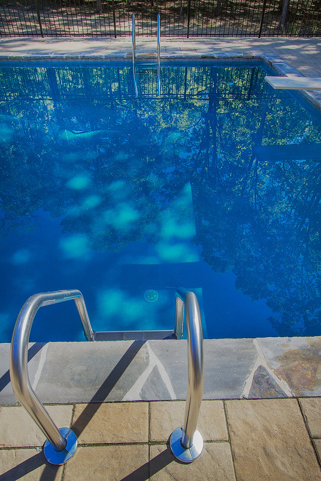 Pool - huge rustic backyard concrete paver and rectangular lap pool idea in Raleigh