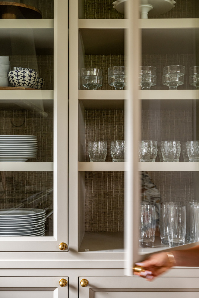 Example of a transitional l-shaped kitchen design in Dallas with recessed-panel cabinets, multicolored backsplash, paneled appliances and white countertops