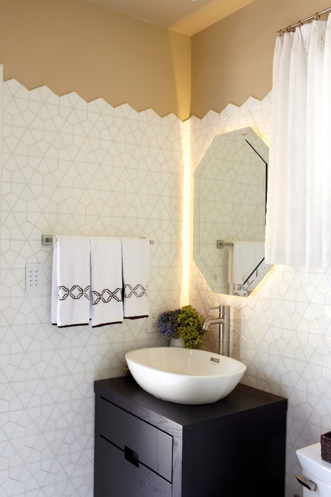 Inspiration for a contemporary powder room remodel in New York with a vessel sink
