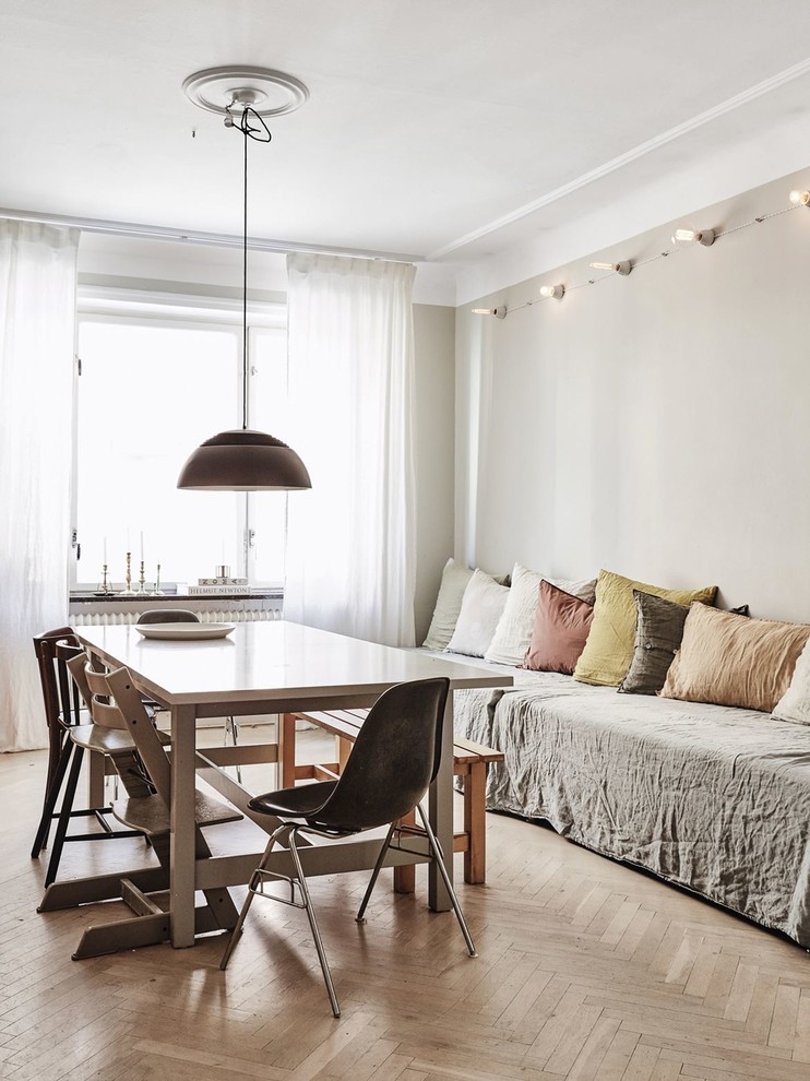 This is an example of a mid-sized scandinavian dining room in Malmo with beige walls.