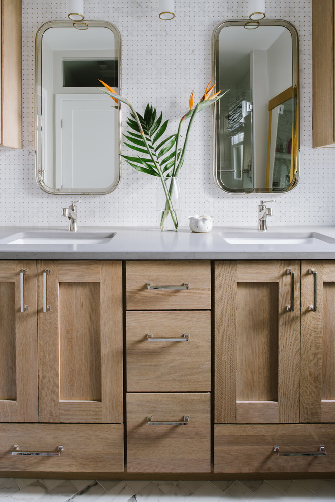 Inspiration for a mid-sized eclectic master bathroom in Austin with shaker cabinets, light wood cabinets, a corner shower, a two-piece toilet, white tile, marble, grey walls, marble floors, an undermount sink, engineered quartz benchtops, white floor and a hinged shower door.