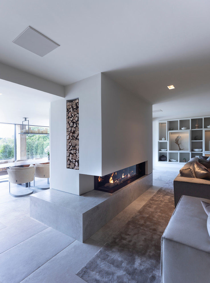 Photo of a large contemporary open concept living room in Cheshire with a music area, white walls, ceramic floors, a corner fireplace, a tile fireplace surround, a concealed tv and white floor.