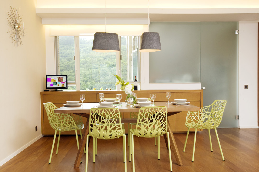 Design ideas for a tropical dining room in Hong Kong with white walls.