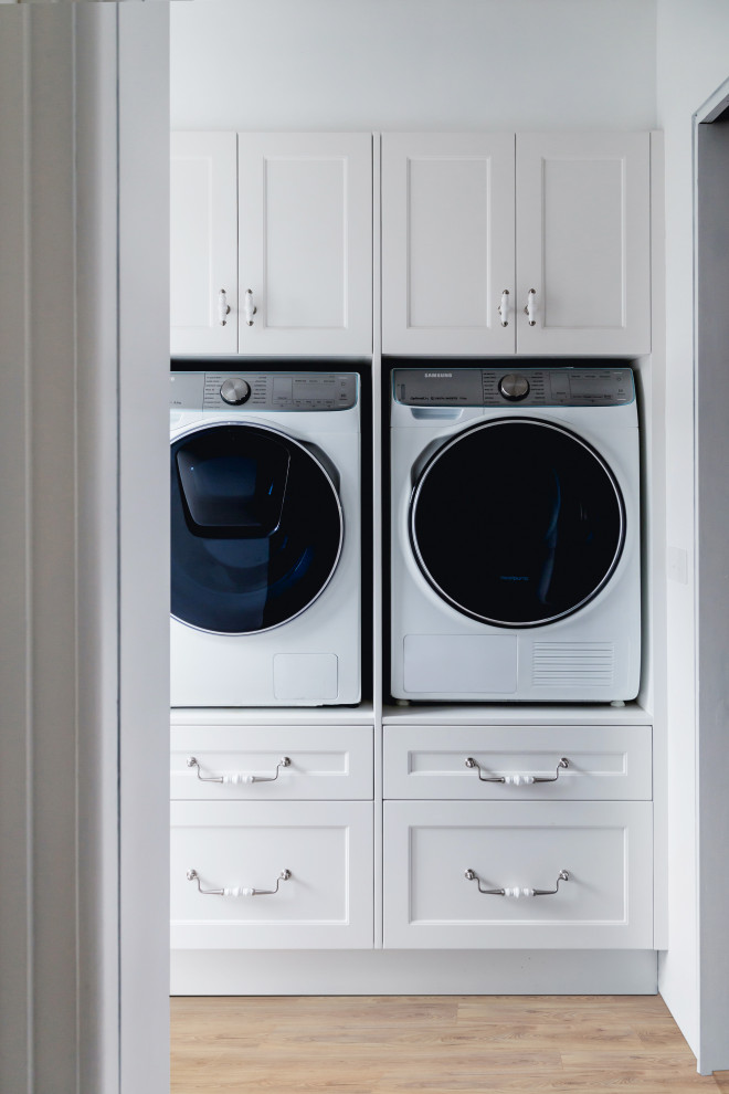 Design ideas for a transitional laundry room in Other.