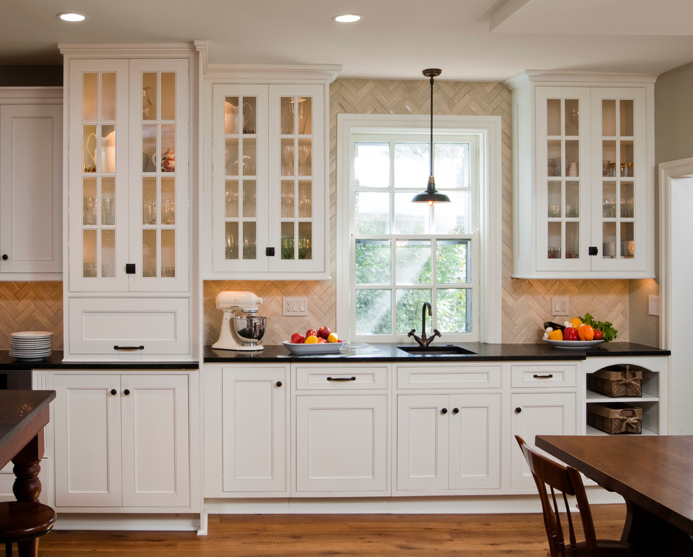 Design ideas for a traditional kitchen in Philadelphia with beaded inset cabinets, white cabinets, limestone benchtops, beige splashback and limestone splashback.