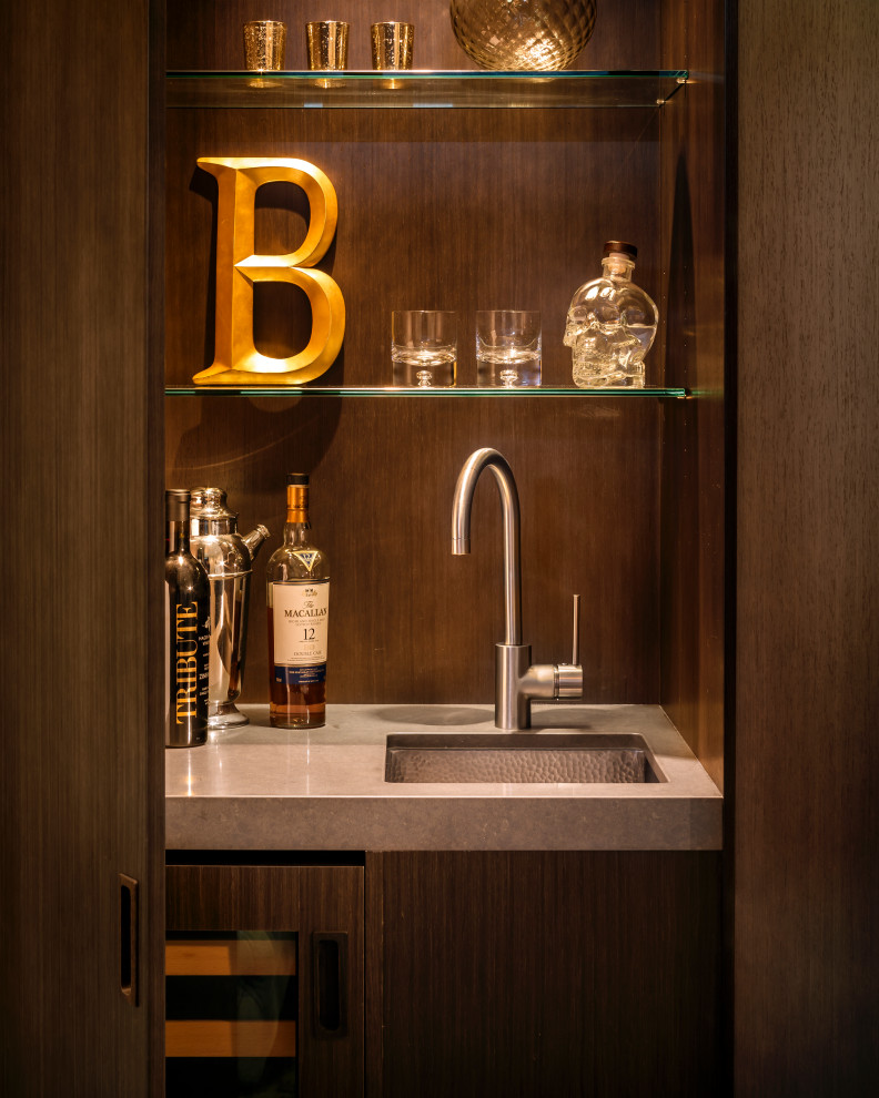 Small contemporary single-wall wet bar in San Francisco with an undermount sink, flat-panel cabinets, brown cabinets, marble benchtops, light hardwood floors, beige floor and brown benchtop.