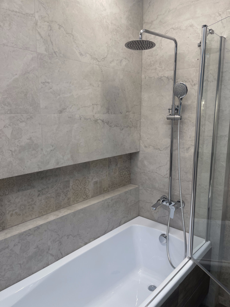 Design ideas for a mid-sized master bathroom in New York with a corner tub, a shower/bathtub combo, beige tile, ceramic tile, beige walls, tile benchtops, a hinged shower door and a niche.