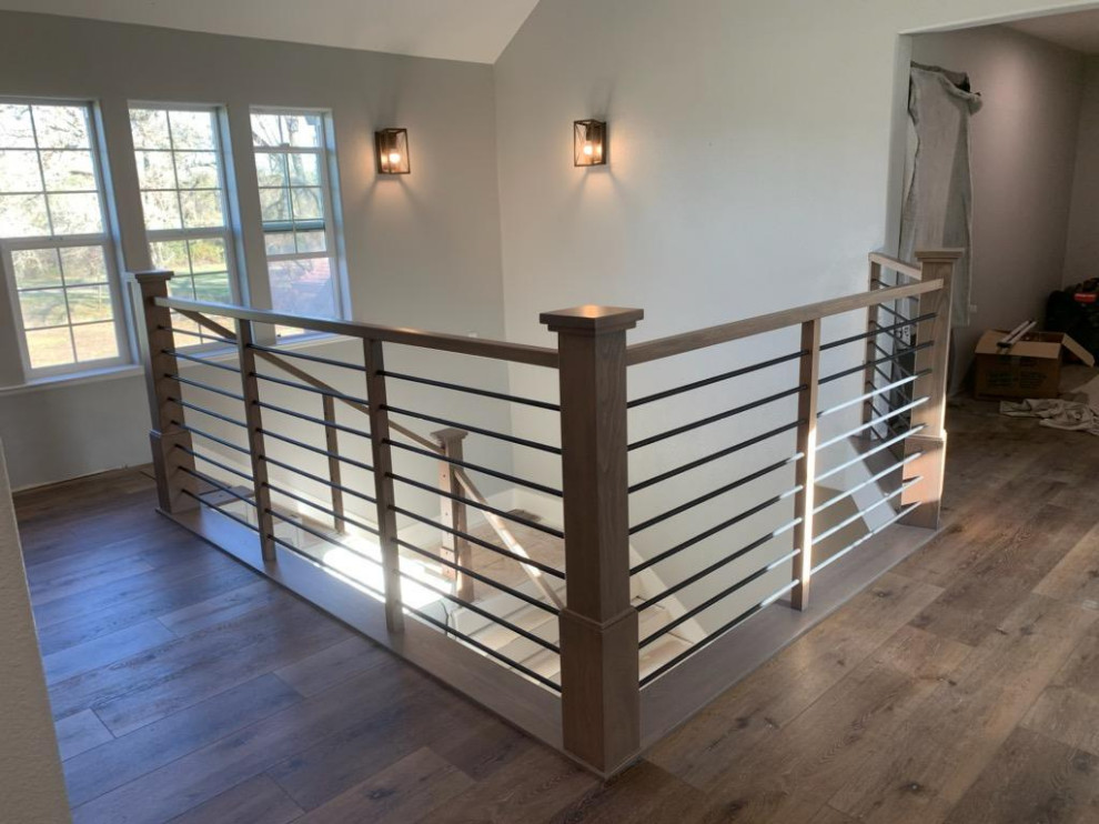 Photo of a large contemporary wood l-shaped staircase in Sacramento with painted wood risers and mixed railing.