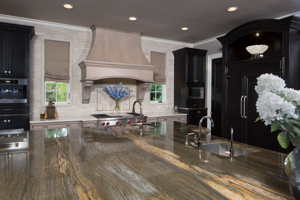 Example of a large transitional dark wood floor enclosed kitchen design in Chicago with gray cabinets, subway tile backsplash, black appliances, an undermount sink, granite countertops, an island, raised-panel cabinets and beige backsplash