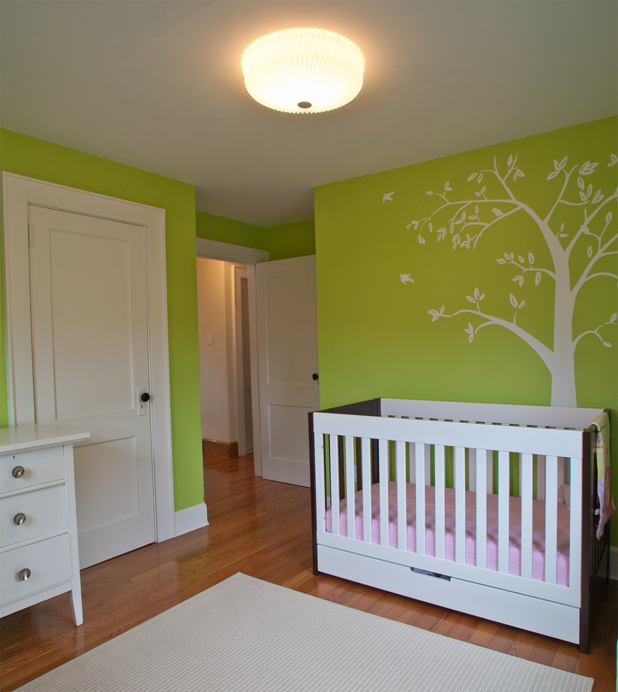 Photo of a mid-sized modern nursery in New York.
