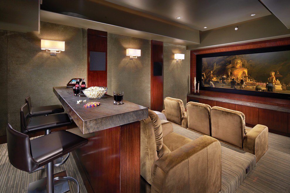 Photo of a tropical enclosed home theatre in Orange County with a built-in media wall.