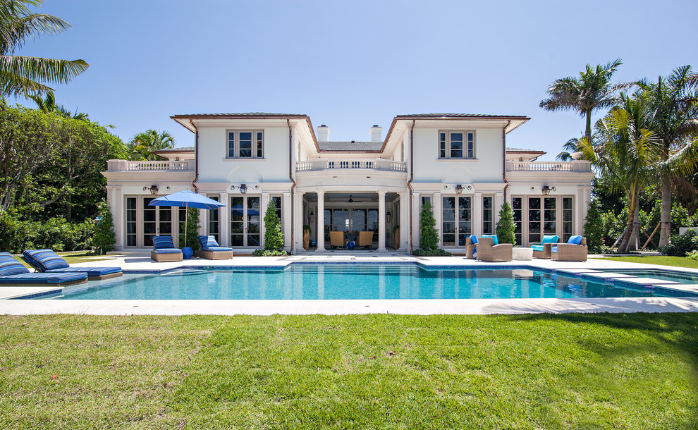 Inspiration for a huge transitional backyard rectangular hot tub remodel in Miami