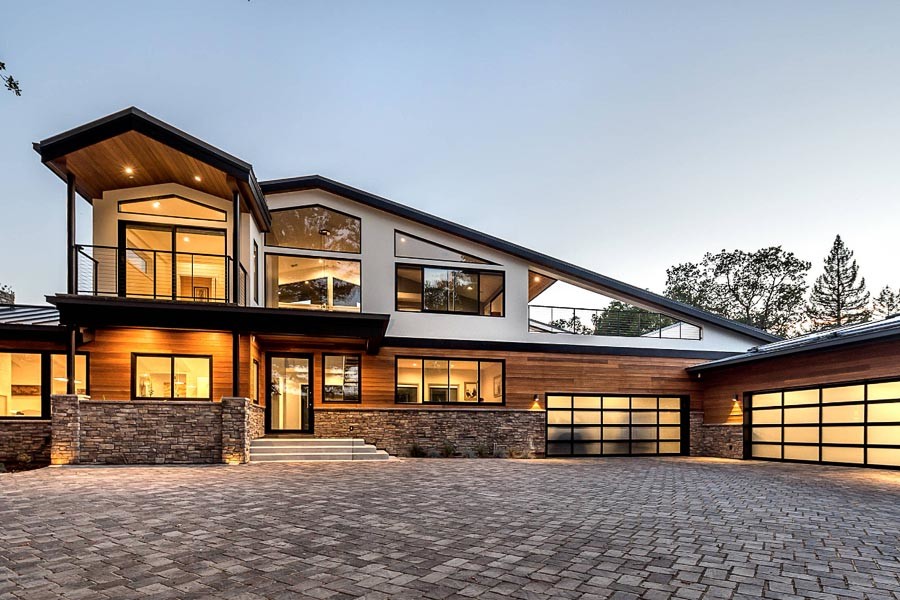 Large contemporary two-storey brown house exterior in San Francisco with wood siding, a gable roof and a metal roof.