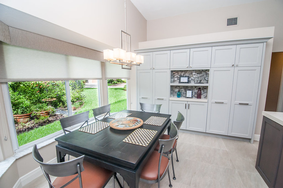 Mid-sized transitional u-shaped porcelain tile and beige floor eat-in kitchen photo in Miami with an undermount sink, shaker cabinets, gray cabinets, quartz countertops, gray backsplash, glass tile backsplash, stainless steel appliances, an island and white countertops