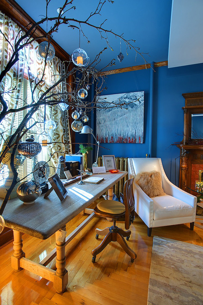 Design ideas for an eclectic home office in Calgary with blue walls.