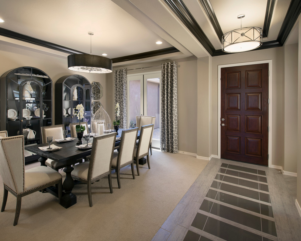 Photo of a contemporary dining room in Phoenix with grey walls and carpet.