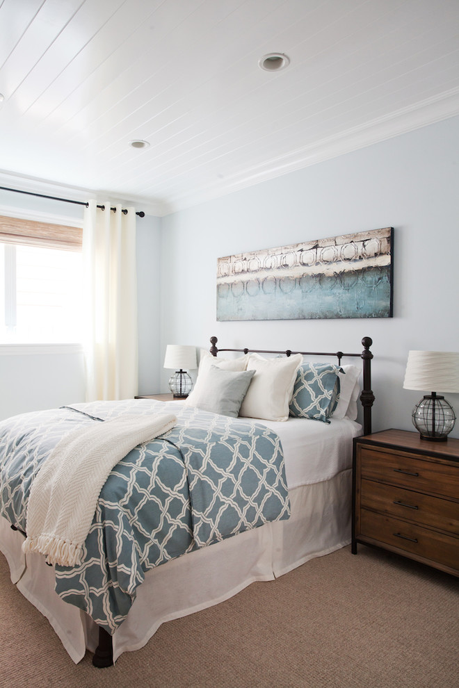 Inspiration for a mid-sized beach style guest bedroom in Orange County with grey walls, carpet, no fireplace and beige floor.