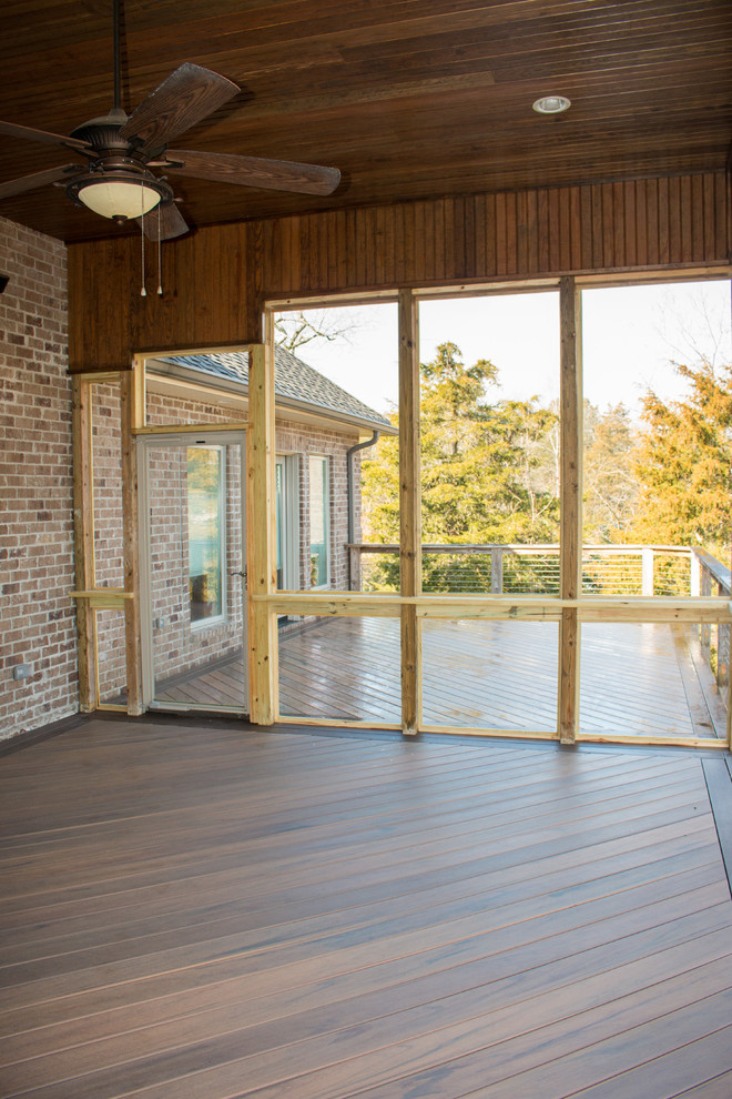 Large trendy backyard deck photo