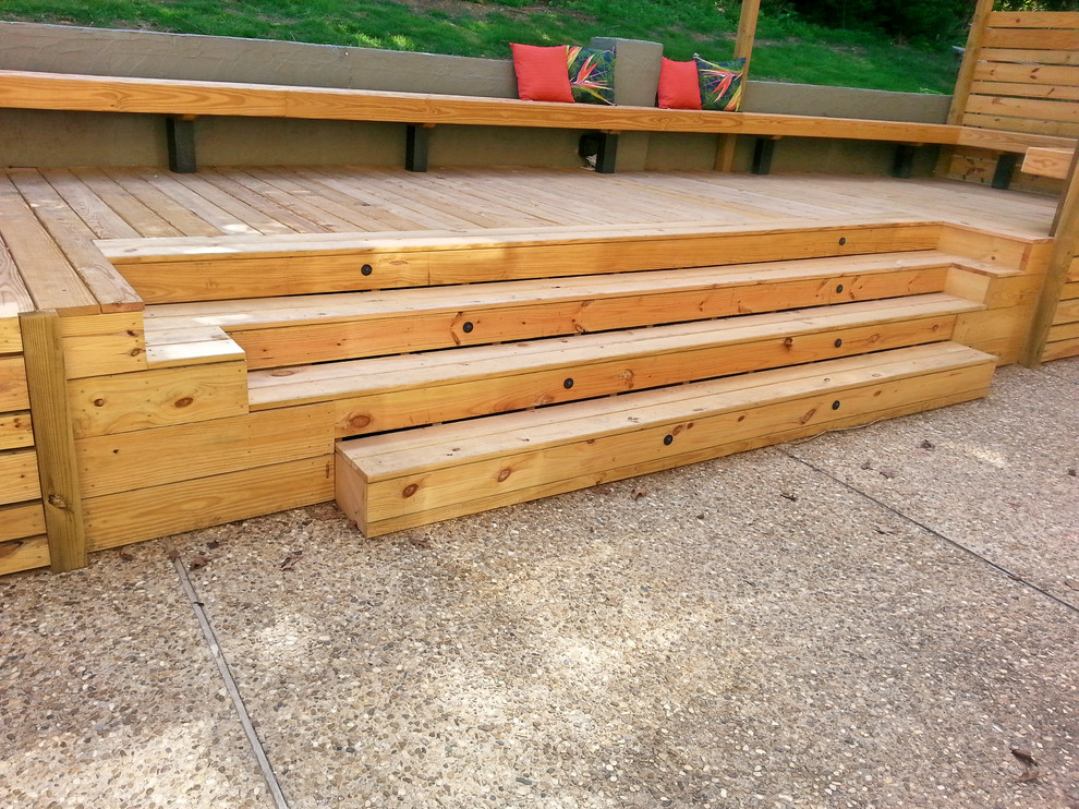 Inspiration for a large backyard deck remodel with a pergola