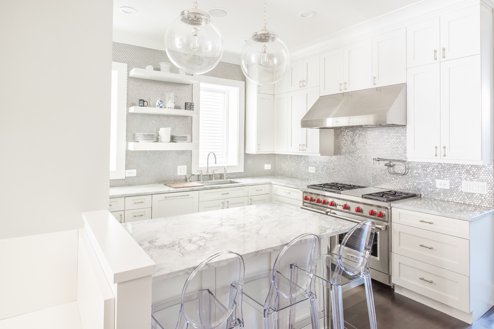 Inspiration for a mid-sized transitional l-shaped dark wood floor open concept kitchen remodel in Chicago with a double-bowl sink, shaker cabinets, white cabinets, quartzite countertops, metallic backsplash, metal backsplash, stainless steel appliances and a peninsula