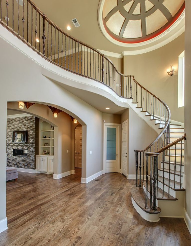 Photo of a traditional foyer in Nashville with beige walls and medium hardwood floors.