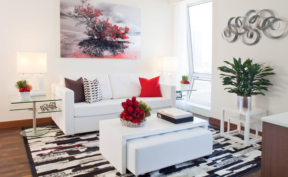 Photo of a small contemporary open concept living room in Miami with white walls.