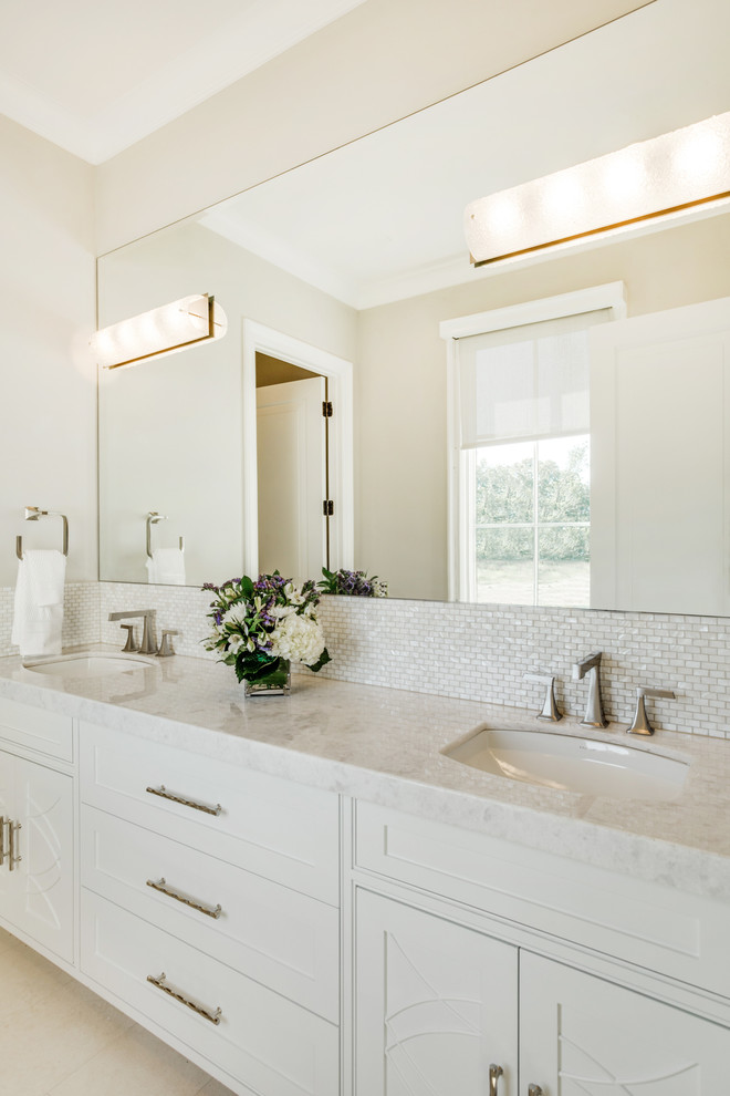 Design ideas for a large transitional master bathroom in Dallas with shaker cabinets, white cabinets, white tile, mosaic tile, white walls, ceramic floors, marble benchtops and an undermount sink.