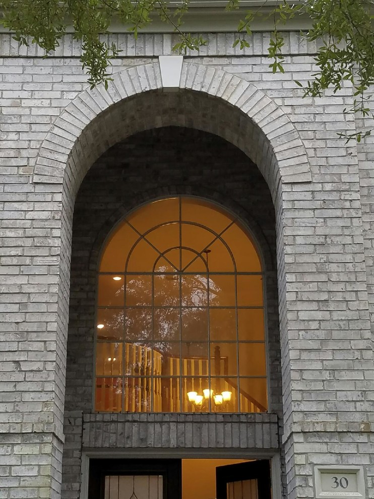 Help! Treatment for Arched window over the front door