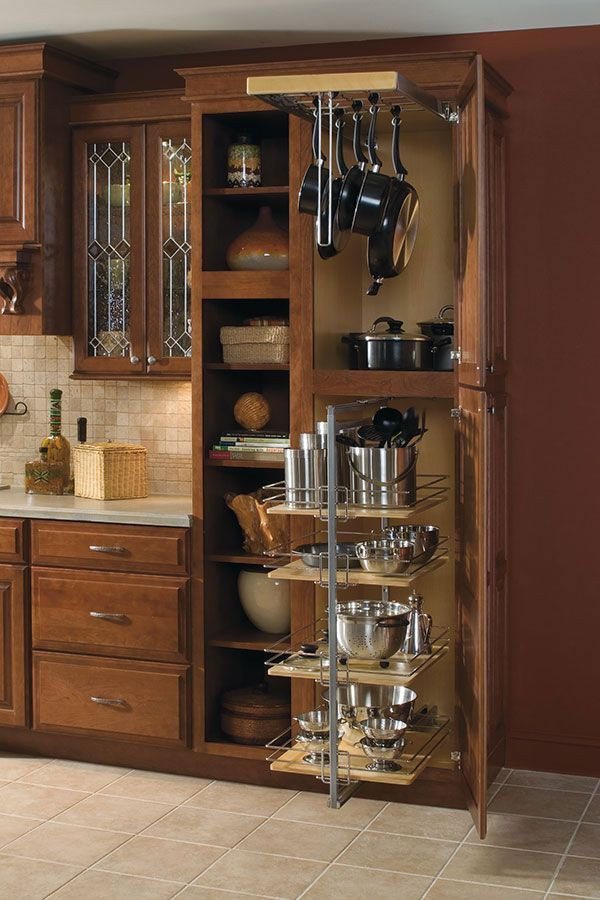 This is an example of a traditional kitchen in Columbus with raised-panel cabinets and brown cabinets.