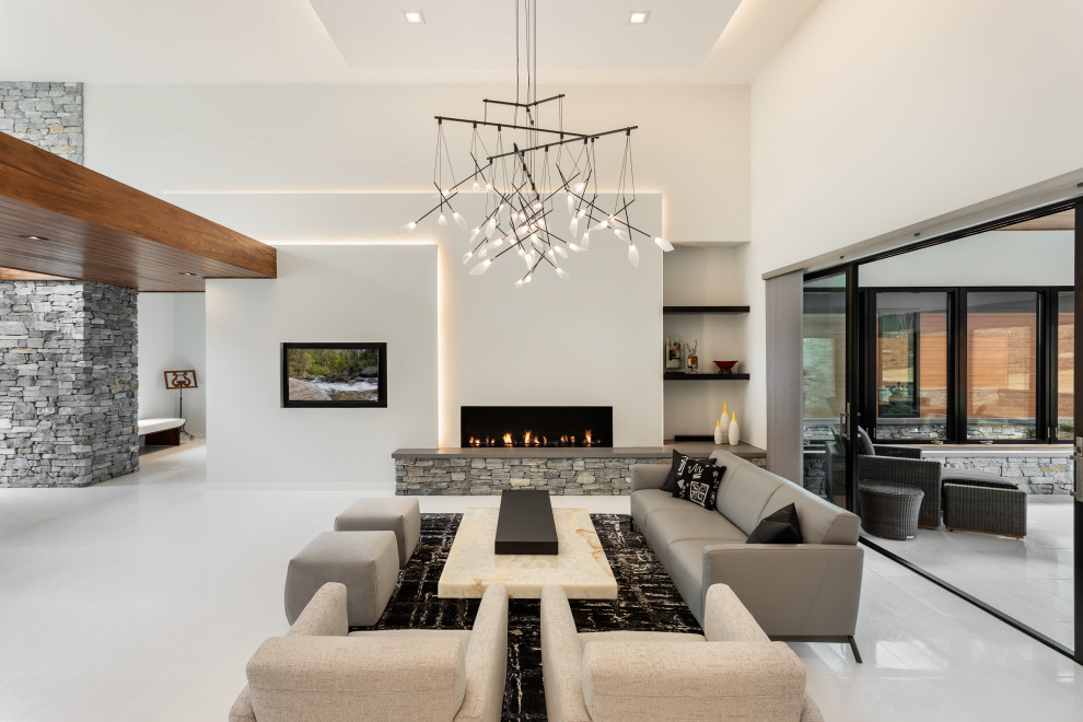 This is an example of a large contemporary open concept family room in Other with white walls, ceramic floors, a ribbon fireplace, a built-in media wall and white floor.