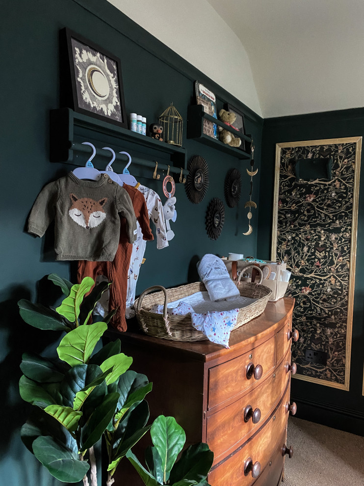 Photo of a medium sized eclectic gender neutral nursery in Hertfordshire with green walls, carpet, beige floors, panelled walls and a dado rail.
