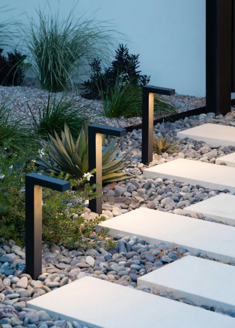 Glowing path lights and agave garden modern-garden
