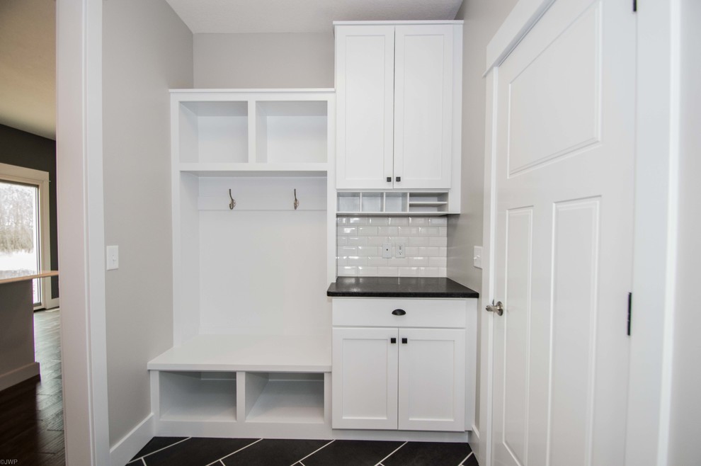 Mid-sized transitional porcelain tile and black floor mudroom photo in Chicago with gray walls and a white front door