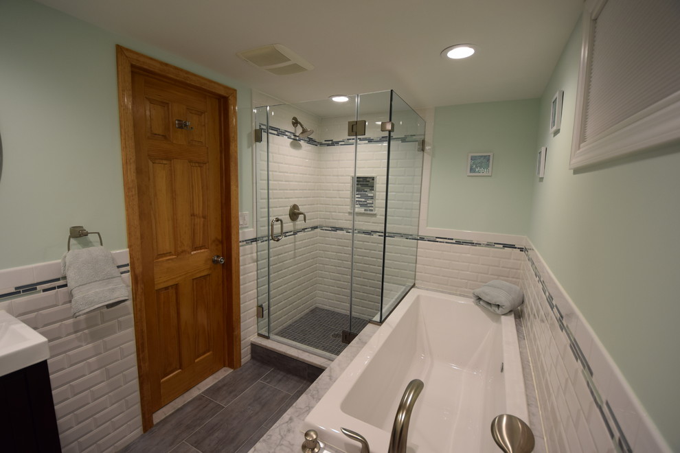 Mid-sized 3/4 bathroom in New York with a console sink, furniture-like cabinets, dark wood cabinets, engineered quartz benchtops, a corner tub, a corner shower, a two-piece toilet, white tile, subway tile, brown walls and linoleum floors.