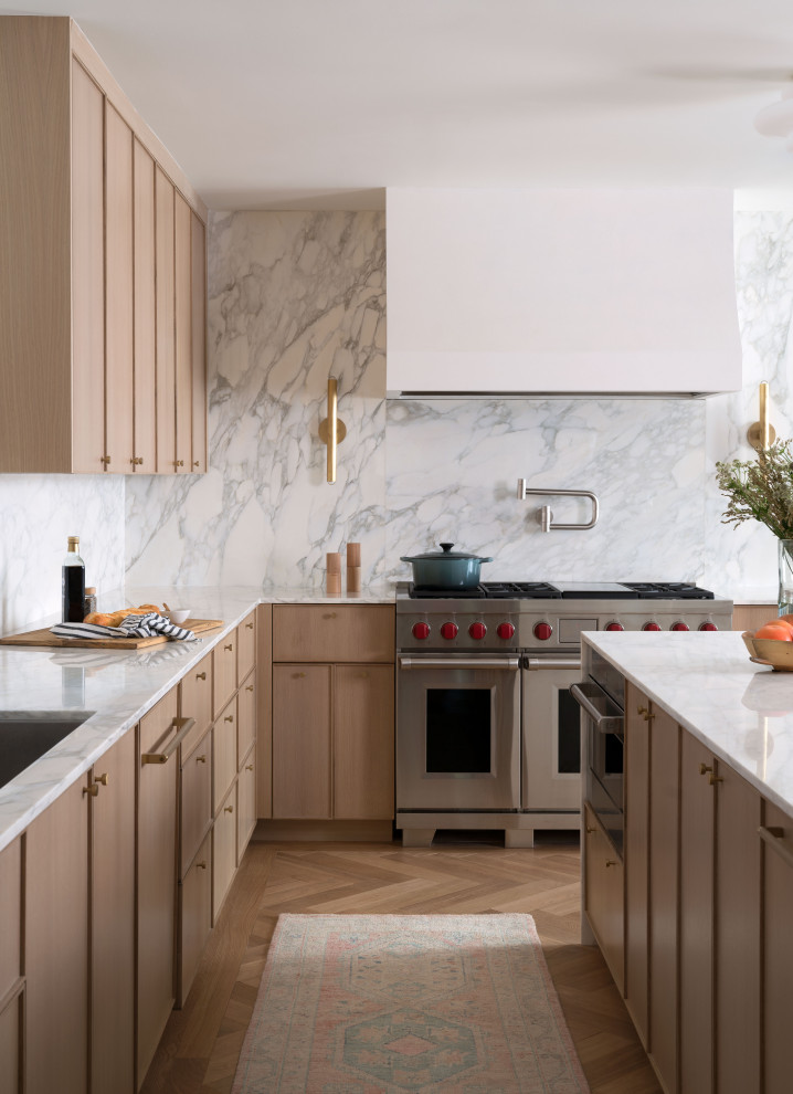 Example of a transitional open concept kitchen design in Austin with shaker cabinets, medium tone wood cabinets and an island