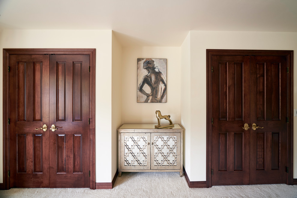 Example of a large transitional master carpeted bedroom design with white walls and no fireplace