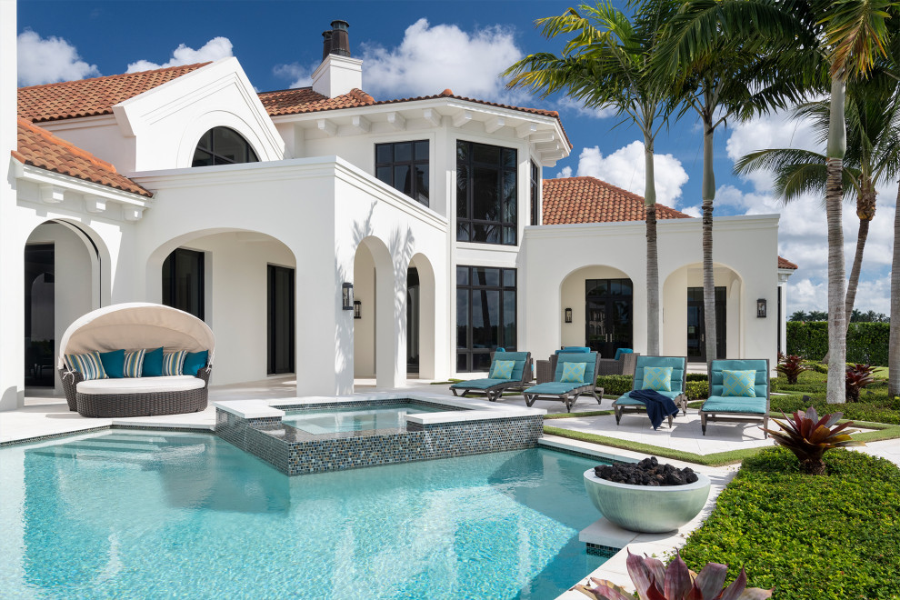 Inspiration for a huge transitional backyard stone and custom-shaped lap pool fountain remodel